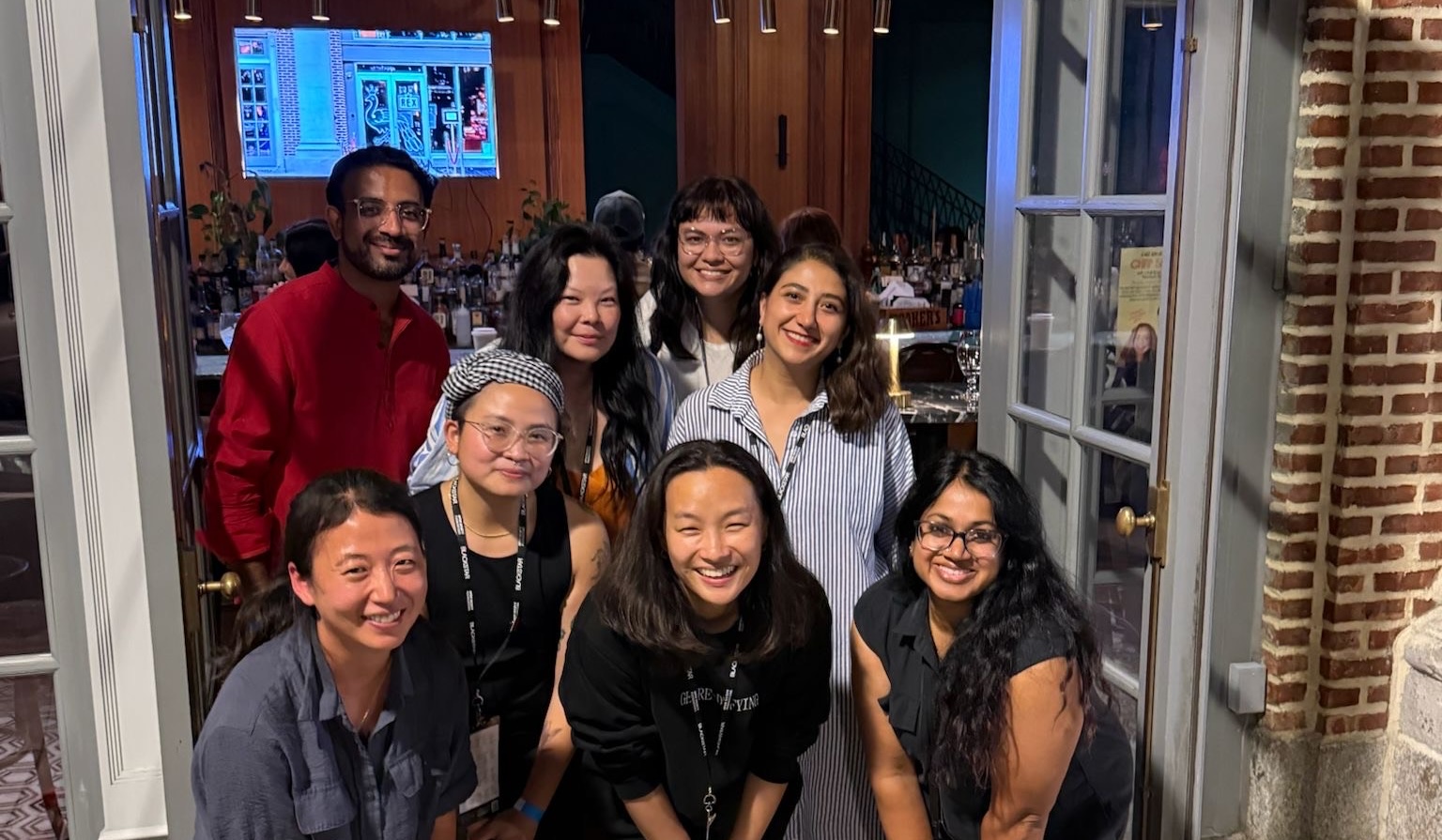 A group of AAPI filmmakers pose for a photo