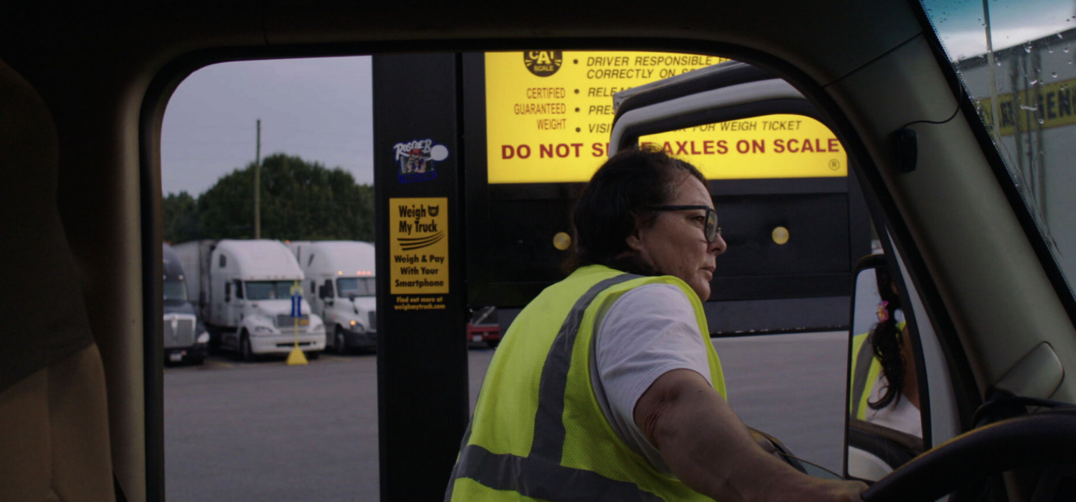 A woman getting into a truck